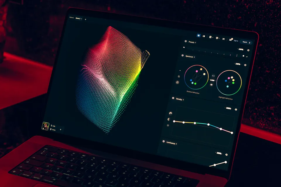 Laptop displaying data visualisations in a dim, modern workspace