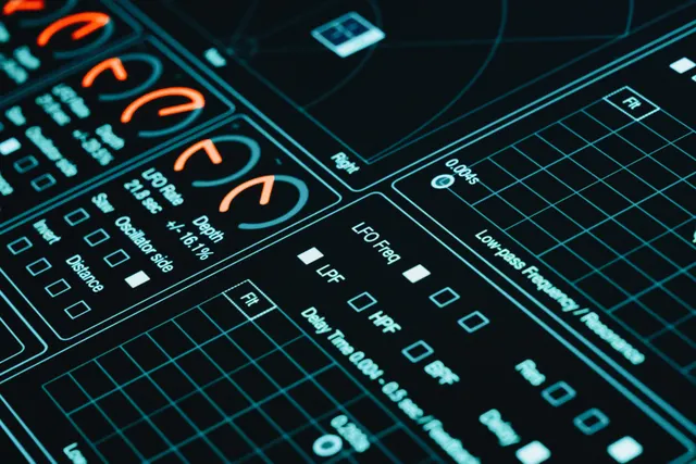 Futuristic touchscreen interface showing graphs and controls in low light